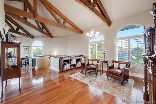 a large kitchen with stainless steel appliances and a large window