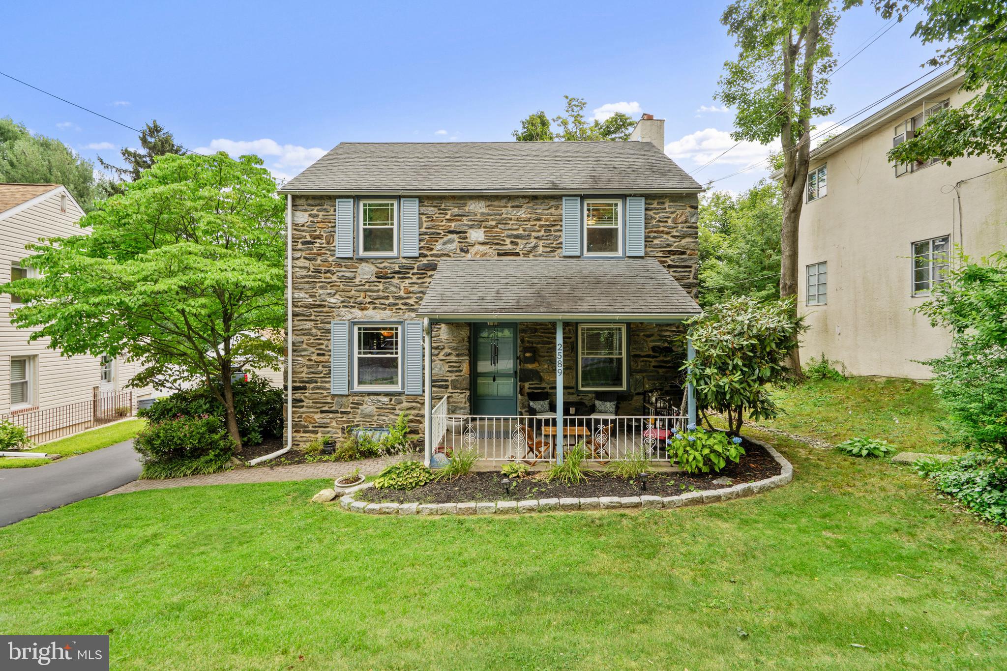 2589 Radcliffe Road Broomall, PA 19008 - Photo 1 of 34 a front view of a house with a yard table and chairs