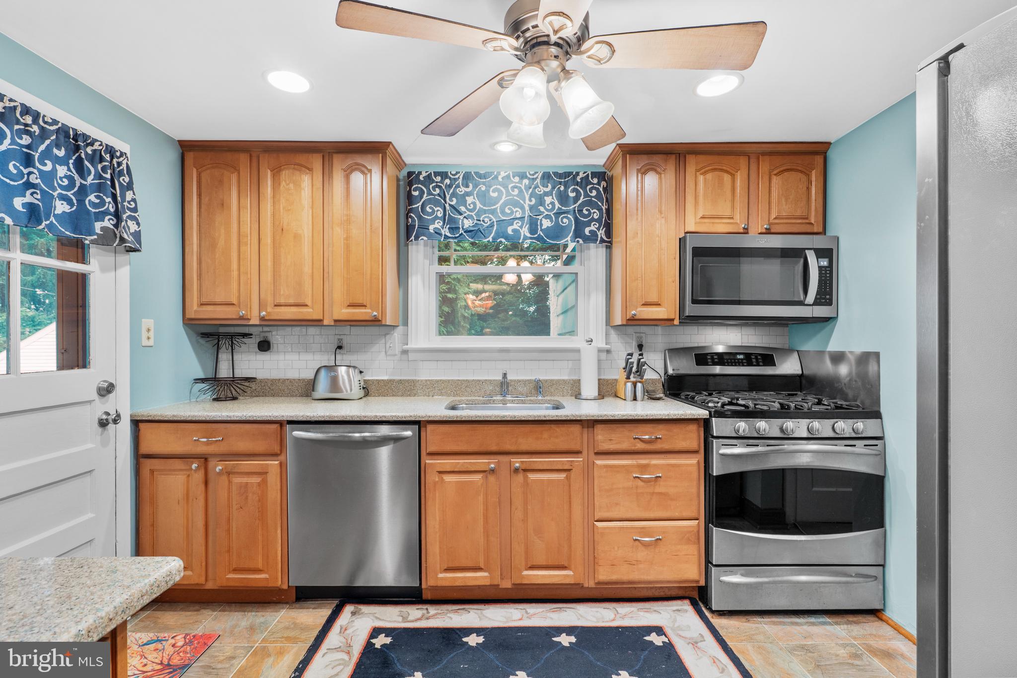 2589 Radcliffe Road Broomall, PA 19008 - Photo 11 of 34 a kitchen with a stove a sink and a microwave