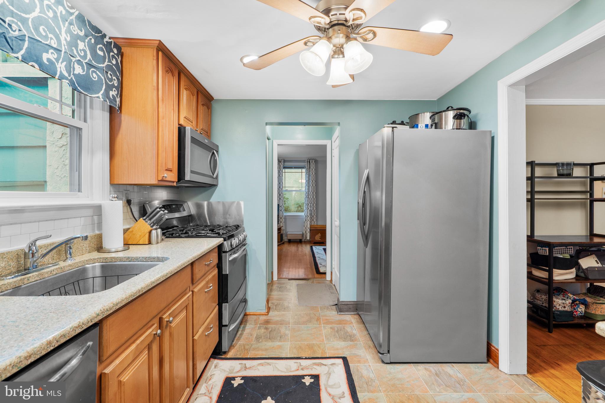 2589 Radcliffe Road Broomall, PA 19008 - Photo 13 of 34 a kitchen with stainless steel appliances granite countertop a refrigerator and a sink