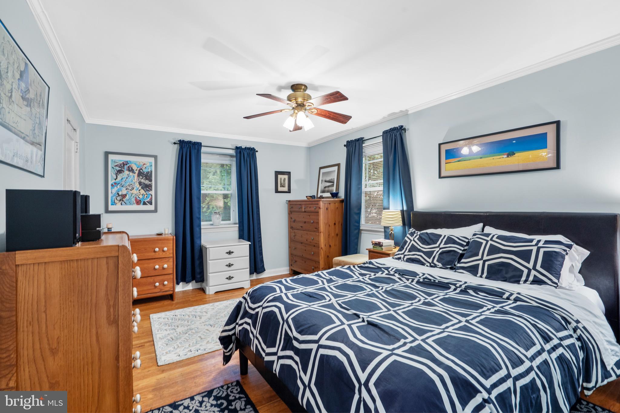 2589 Radcliffe Road Broomall, PA 19008 - Photo 16 of 34 a bedroom with a bed and wooden floor