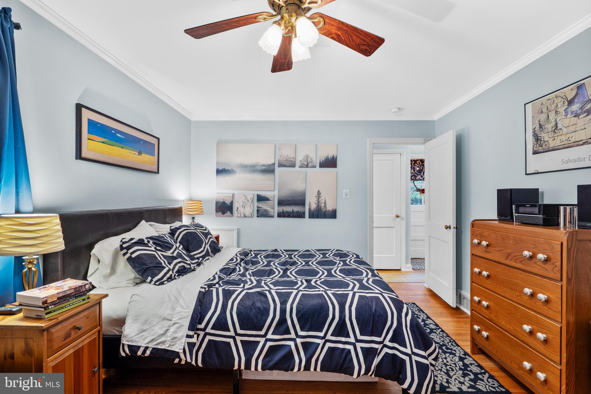 2589 Radcliffe Road Broomall, PA 19008 - Photo 17 of 34 a bedroom with a bed and a chandelier