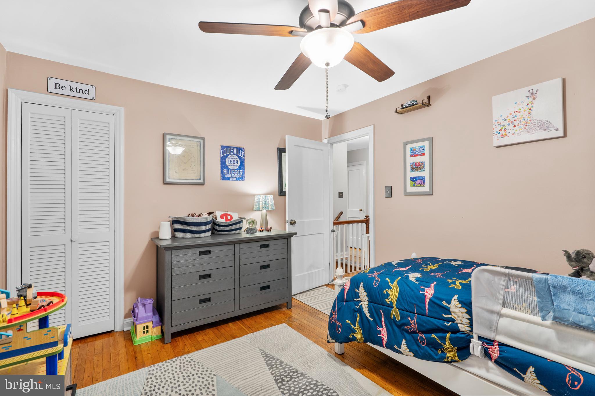 2589 Radcliffe Road Broomall, PA 19008 - Photo 19 of 34 a bedroom with a bed and a chandelier