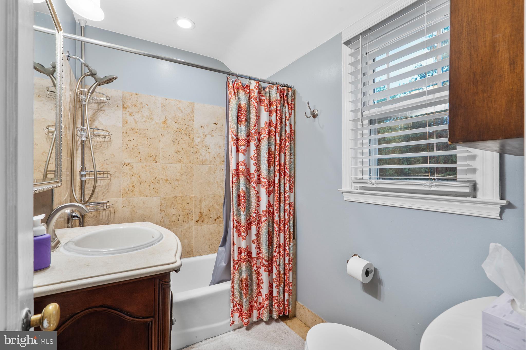 2589 Radcliffe Road Broomall, PA 19008 - Photo 22 of 34 a bathroom with a sink a mirror a toilet and shower
