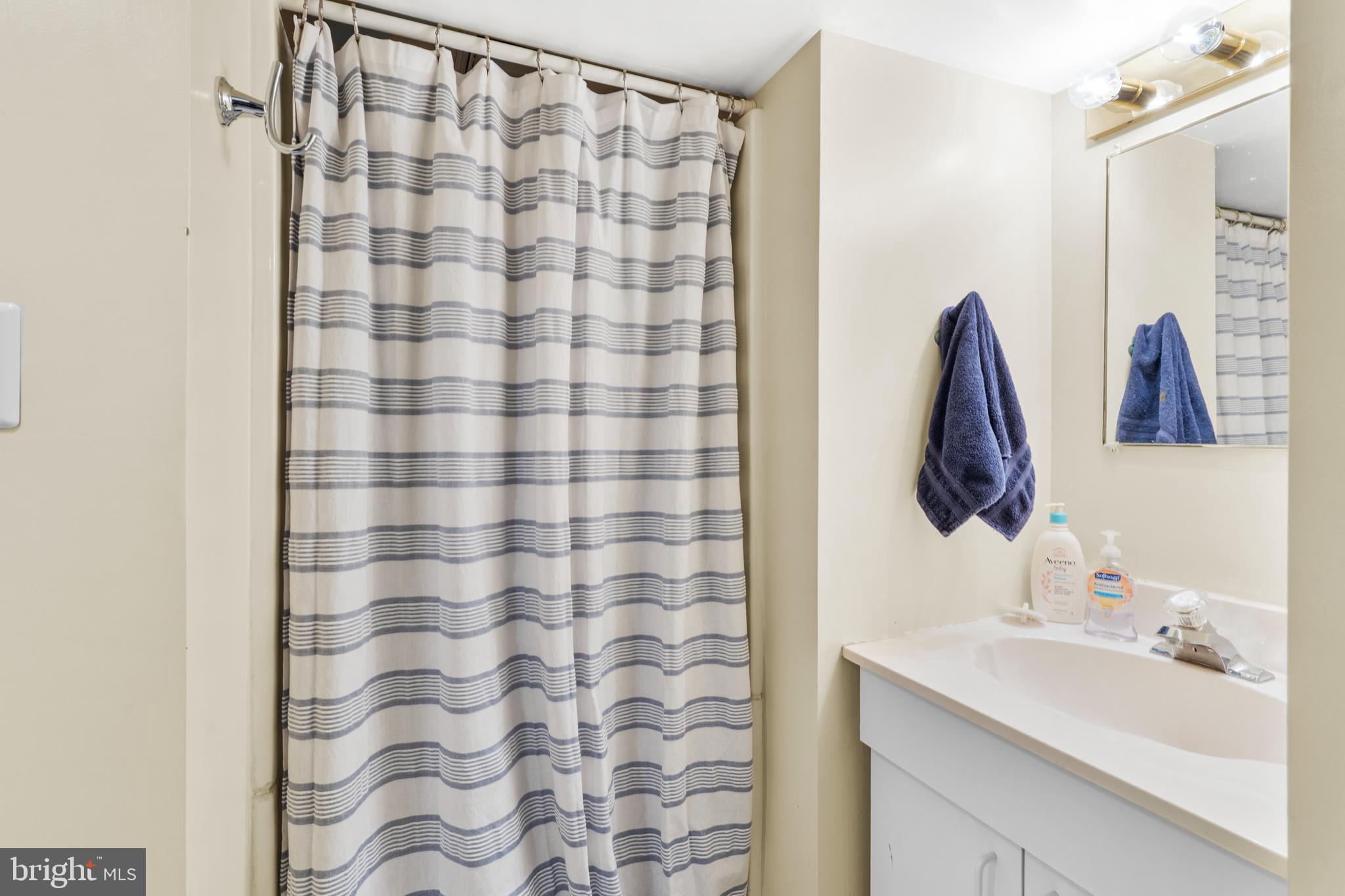 2589 Radcliffe Road Broomall, PA 19008 - Photo 26 of 34 a bathroom with a sink and a mirror
