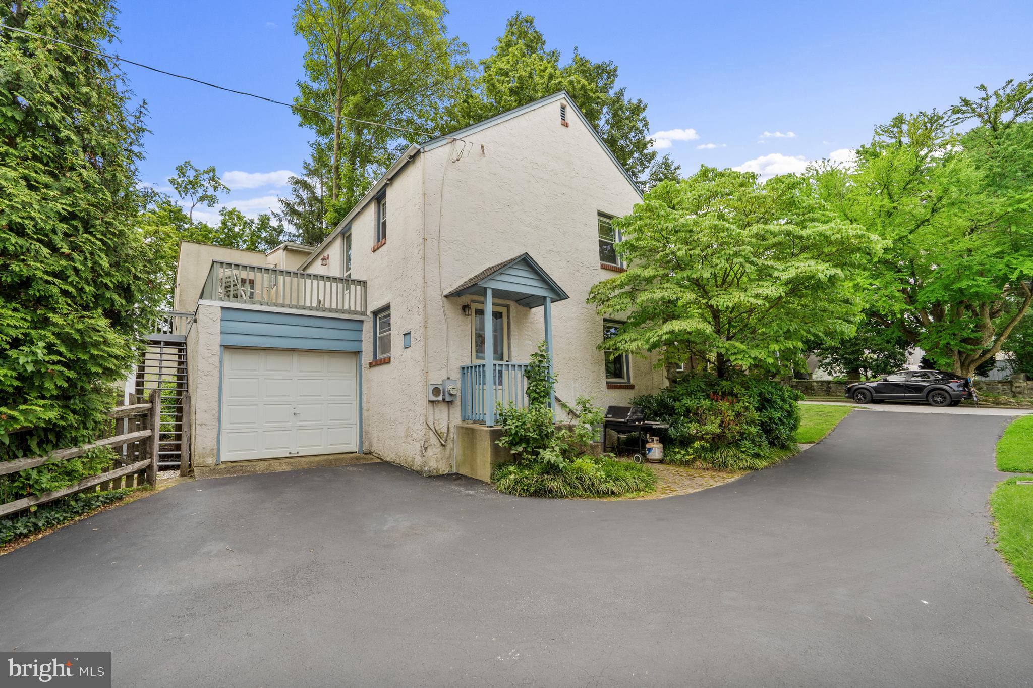 2589 Radcliffe Road Broomall, PA 19008 - Photo 27 of 34 a view of a house with a yard and garage