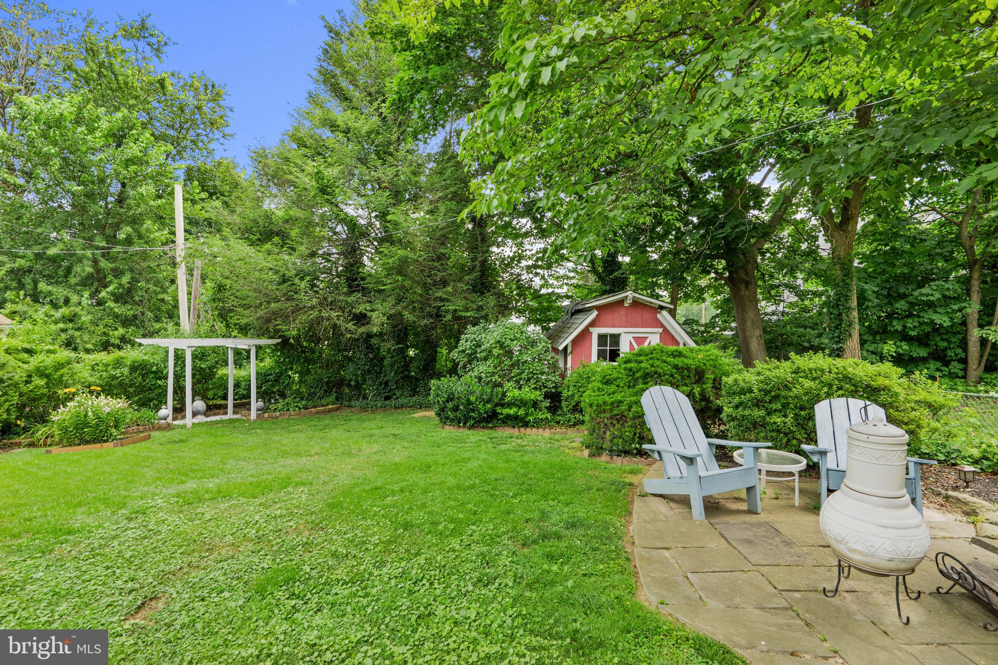 2589 Radcliffe Road Broomall, PA 19008 - Photo 28 of 34 a view of a chairs and table in backyard