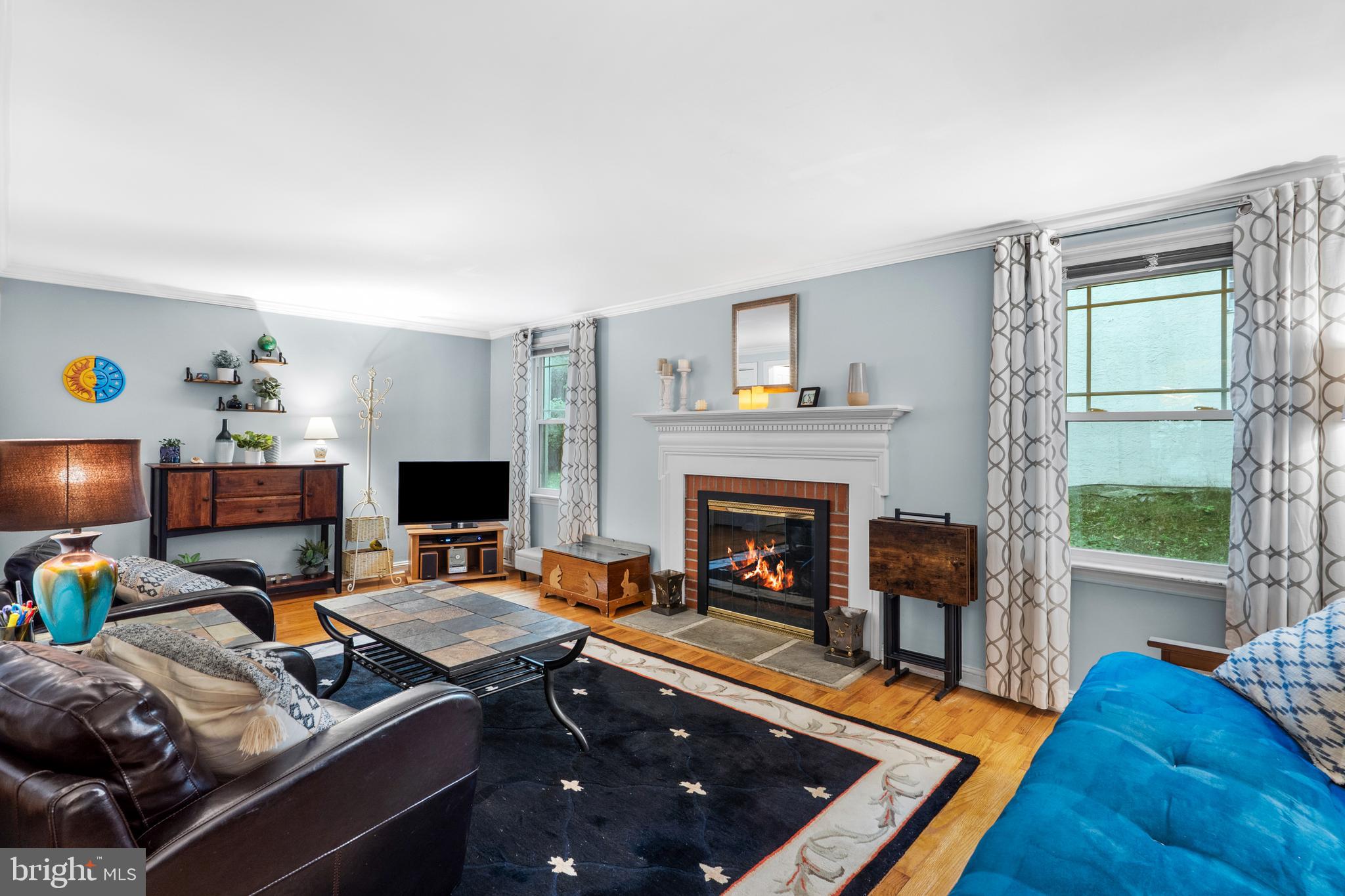 2589 Radcliffe Road Broomall, PA 19008 - Photo 6 of 34 a living room with furniture and a fireplace