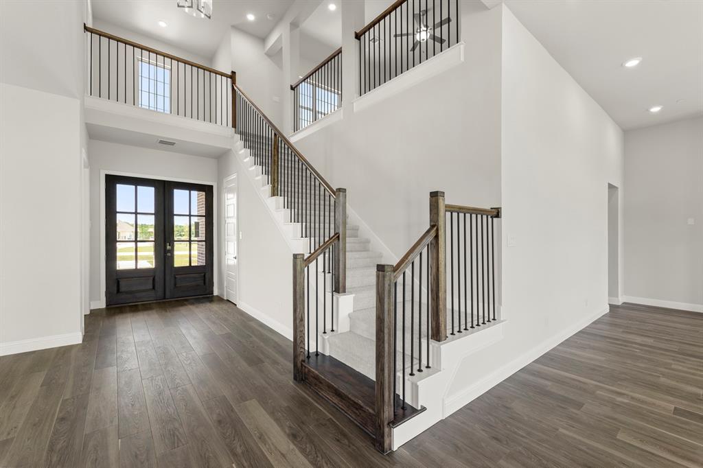 a view of staircase with white walls and a window