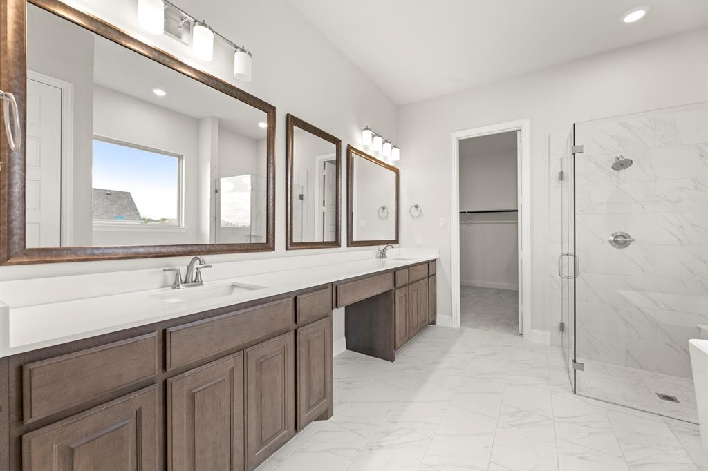 403 Spoonbill Road Sunnyvale, TX 75182 - Photo 20 of 34 a bathroom with a double vanity sink mirror double and shower
