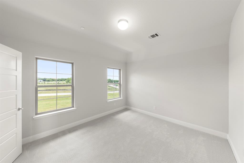 403 Spoonbill Road Sunnyvale, TX 75182 - Photo 25 of 34 a view of an empty room with a window