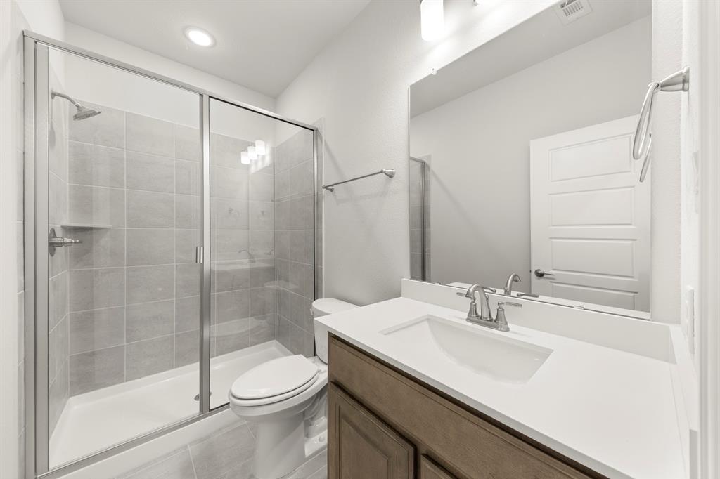 403 Spoonbill Road Sunnyvale, TX 75182 - Photo 26 of 34 a bathroom with a sink toilet and shower