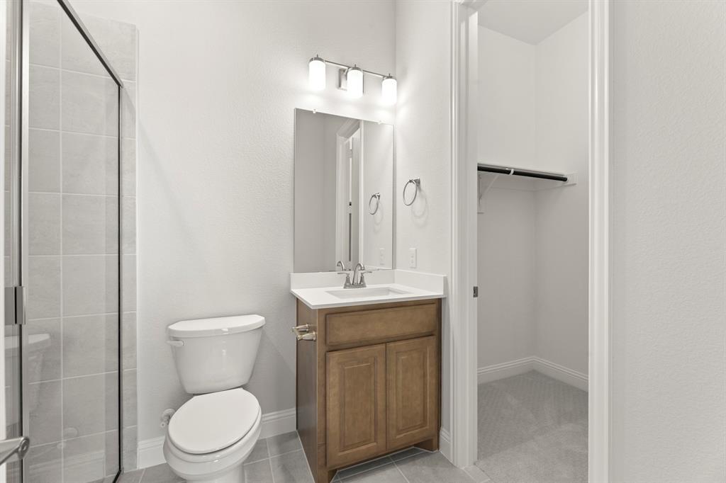 403 Spoonbill Road Sunnyvale, TX 75182 - Photo 30 of 34 a bathroom with a sink a toilet and shower