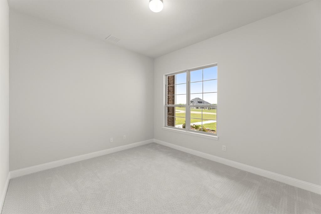 403 Spoonbill Road Sunnyvale, TX 75182 - Photo 31 of 34 an empty room with a window