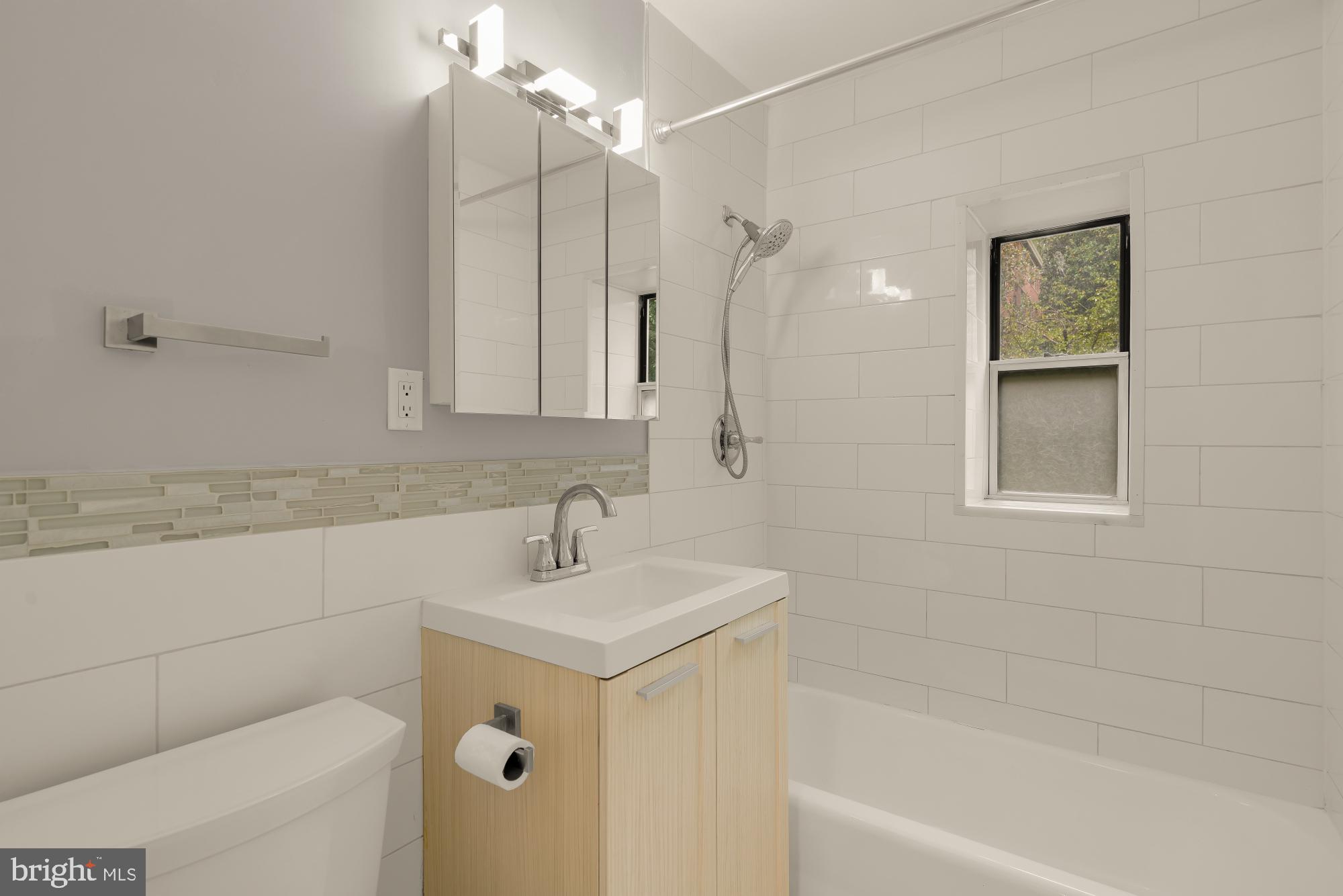 4100 W Street Northwest, Unit 101 Washington, DC 20007 - Photo 26 of 28 Renovated bathroom