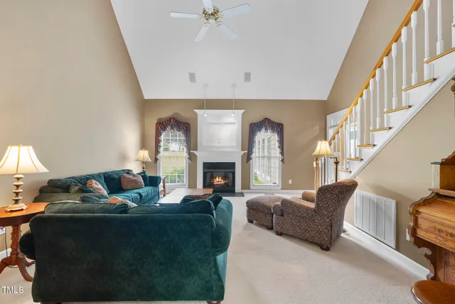 a view of a deck and a yard with green space