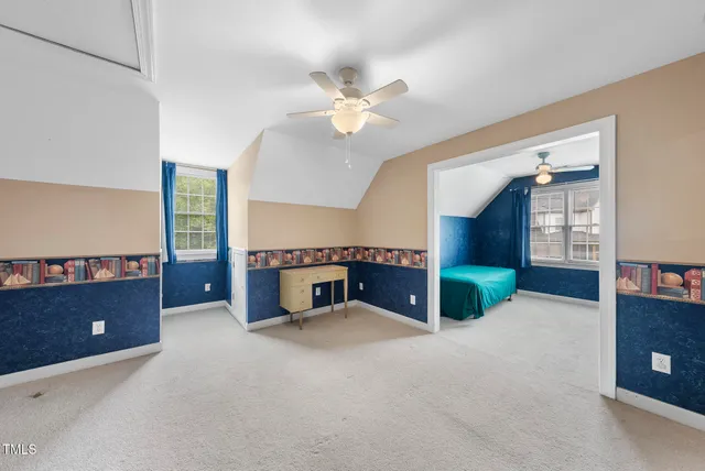 a view of a kitchen with a sink and a fireplace