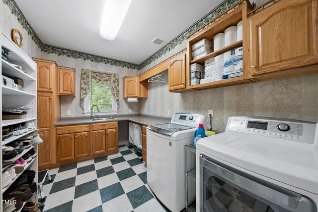 a kitchen with kitchen island and a stove