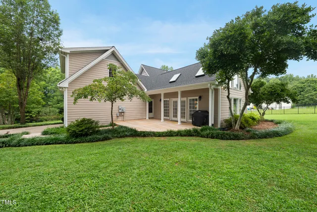 a view of a park with trees in the background