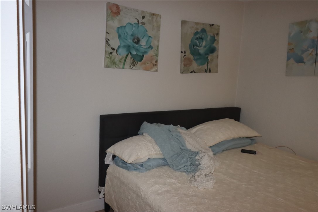5529 Granada Road Fort Myers, FL 33919 - Photo 18 of 29 a close view of a bed in a room