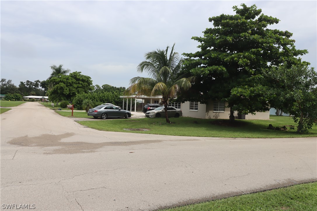 5529 Granada Road Fort Myers, FL 33919 - Photo 2 of 29 a view of outdoor space with garden and trees