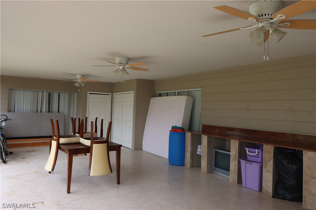 5529 Granada Road Fort Myers, FL 33919 - Photo 24 of 29 a view of a livingroom with furniture and a ceiling fan