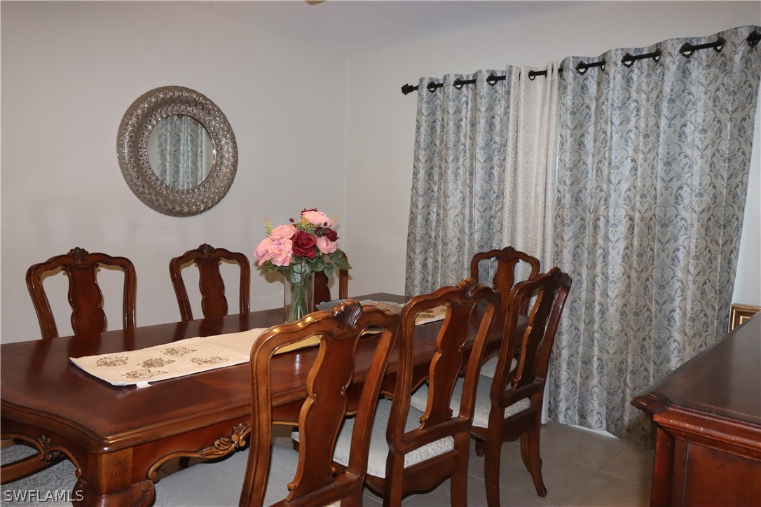 5529 Granada Road Fort Myers, FL 33919 - Photo 5 of 29 a view of a dining room with furniture and a chandelier