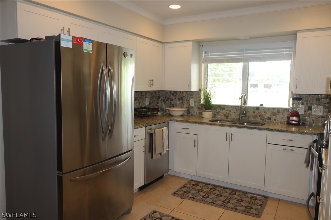 5529 Granada Road Fort Myers, FL 33919 - Photo 7 of 29 a kitchen with stainless steel appliances granite countertop a refrigerator and a sink
