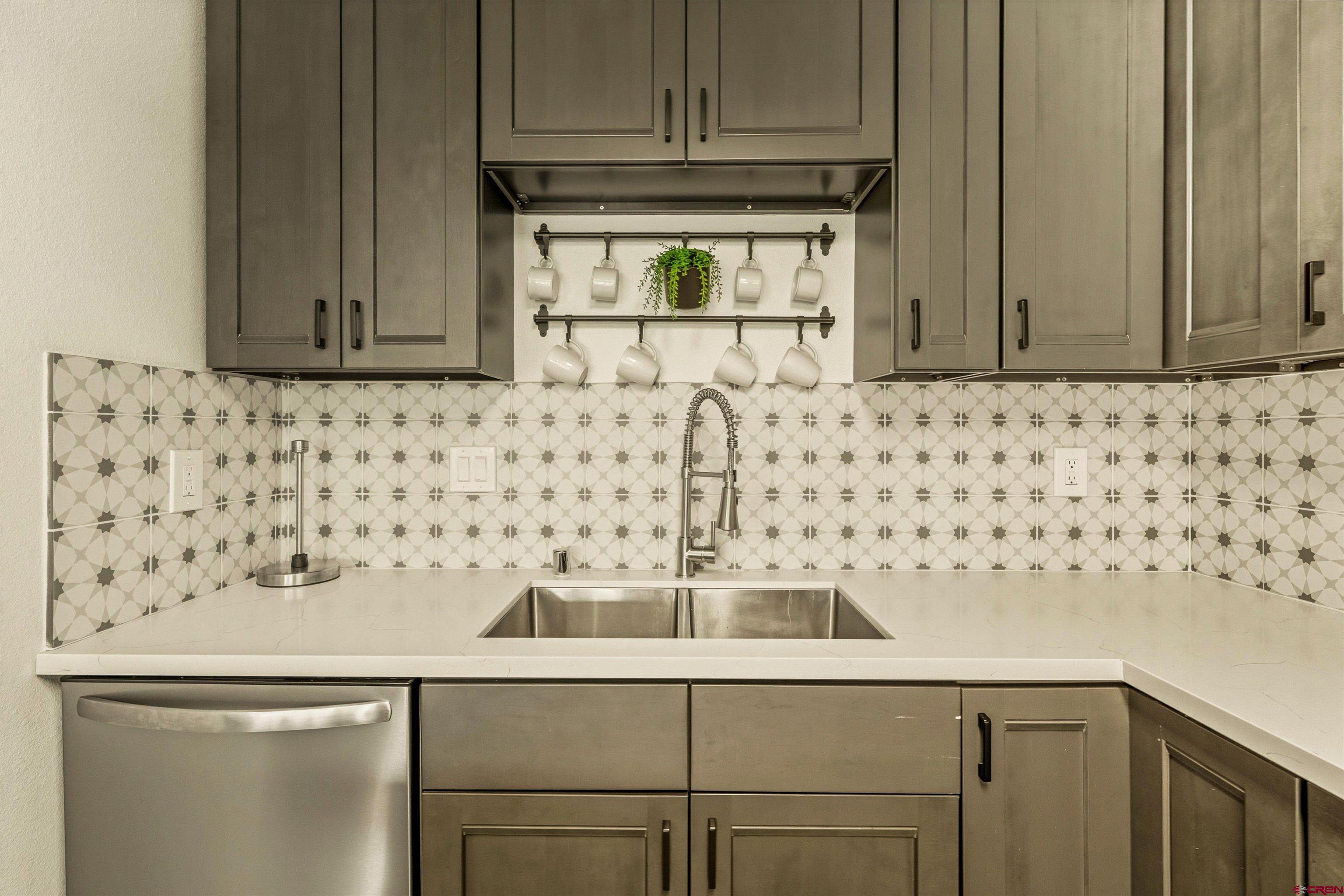 217 Pinon Causeway, Unit 3022 Pagosa Springs, CO 81147 - Photo 12 of 42 a kitchen with a sink and cabinets