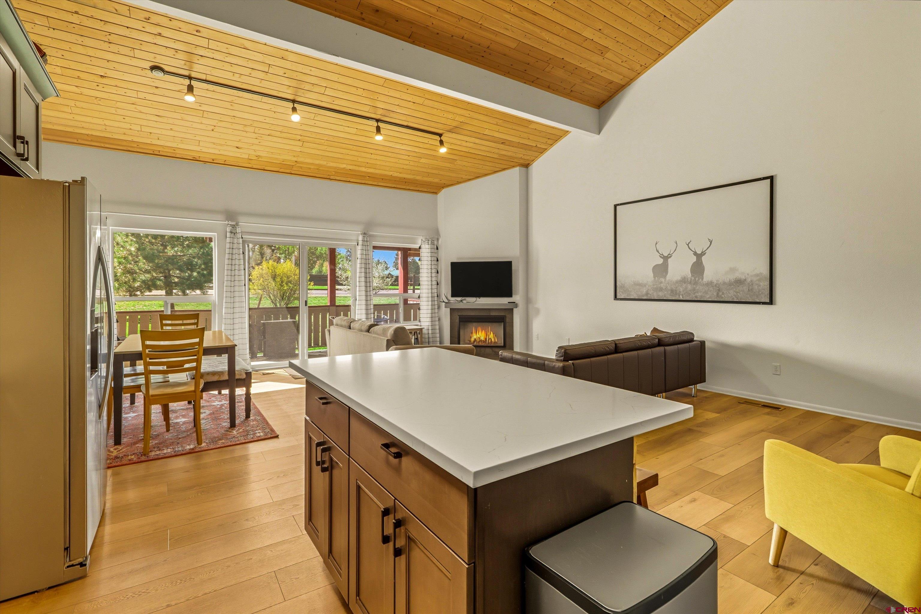 217 Pinon Causeway, Unit 3022 Pagosa Springs, CO 81147 - Photo 13 of 42 a living room with furniture a flat screen tv and a table