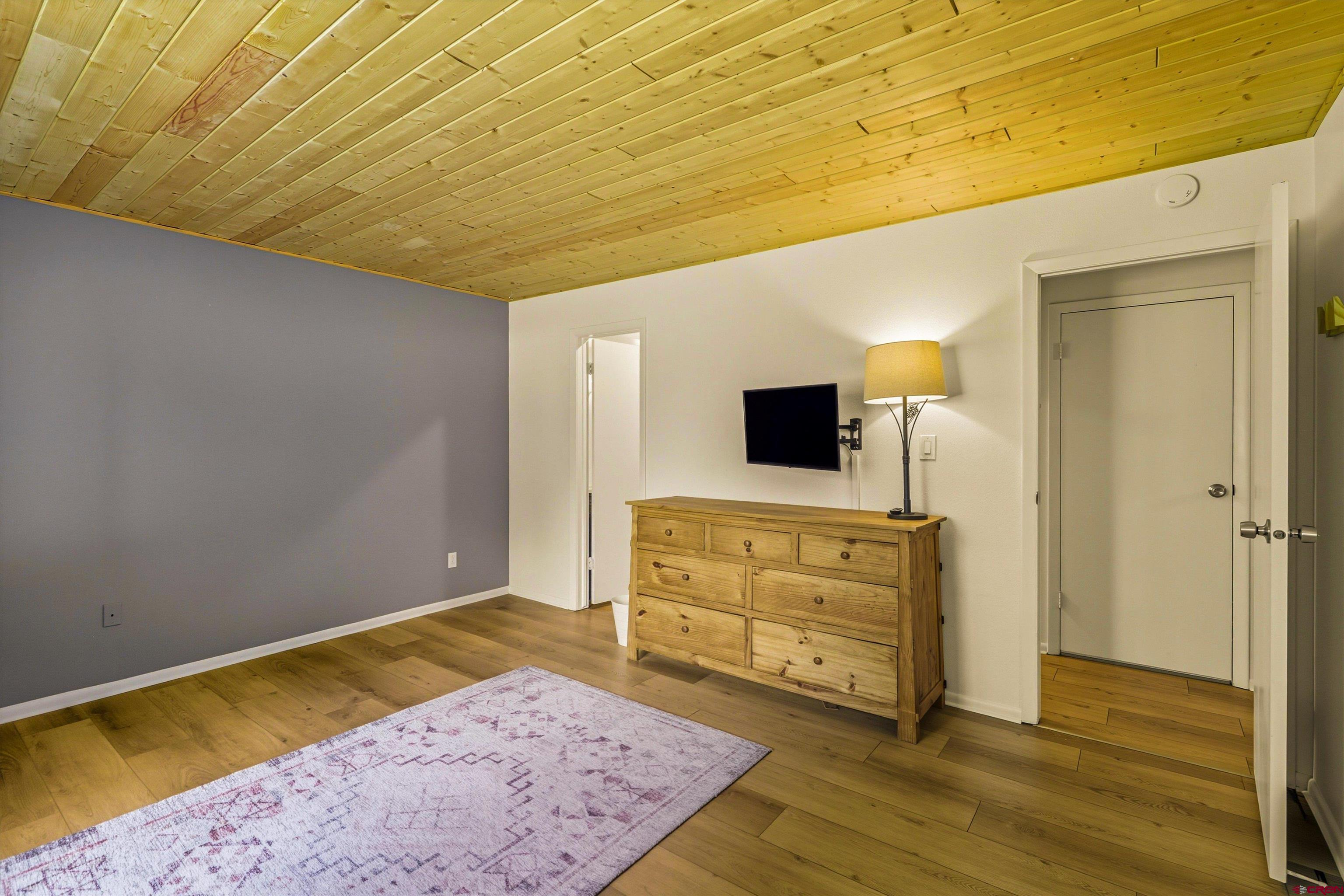 217 Pinon Causeway, Unit 3022 Pagosa Springs, CO 81147 - Photo 16 of 42 a room with a bed and a television