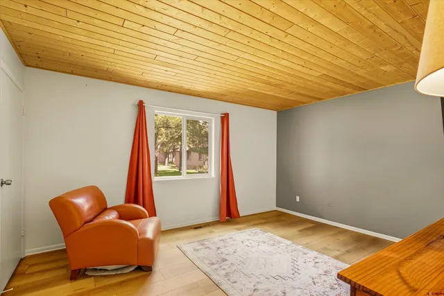 a view of workspace with furniture and window