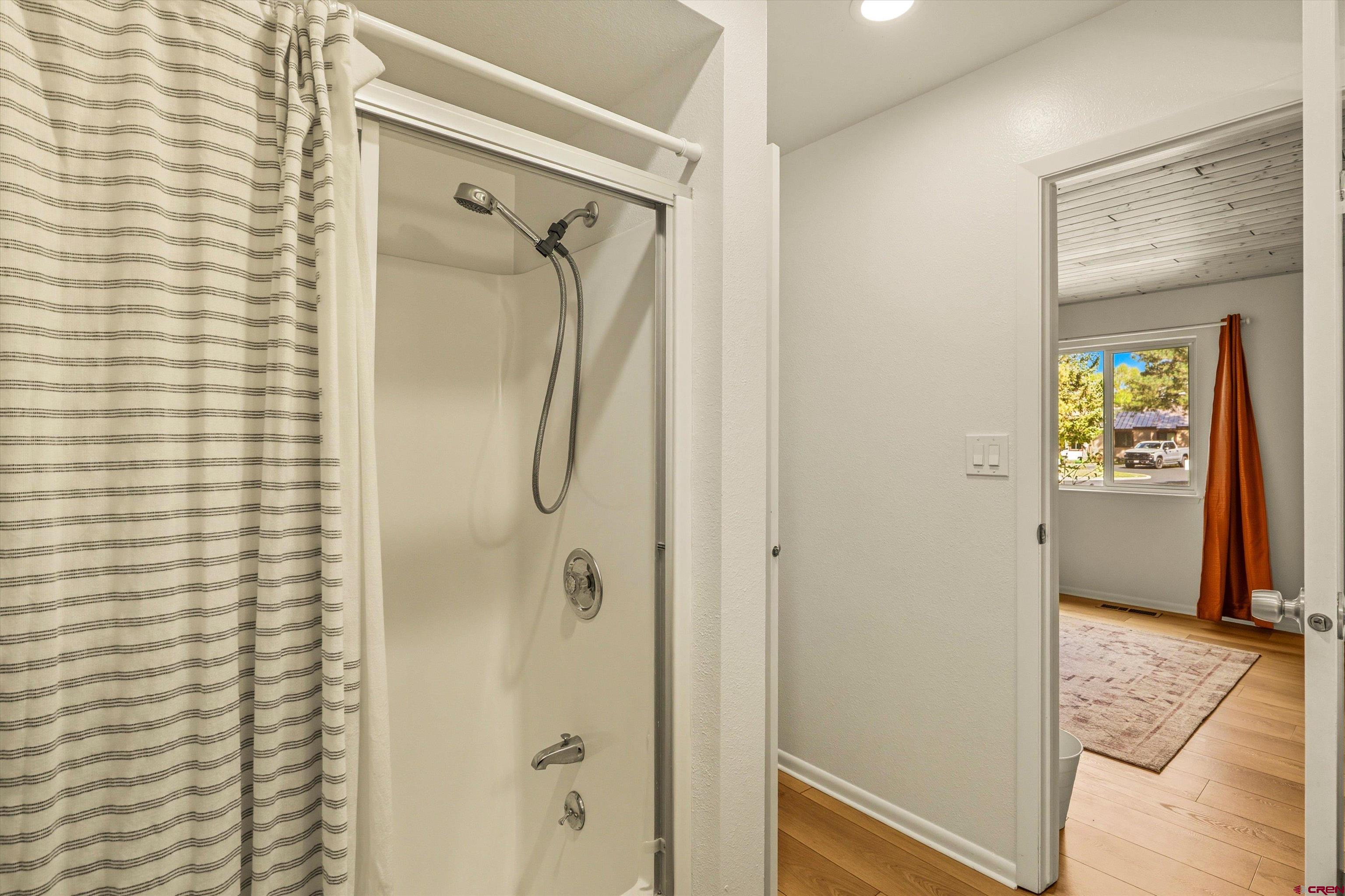 217 Pinon Causeway, Unit 3022 Pagosa Springs, CO 81147 - Photo 20 of 42 a bathroom with a shower and a mirror