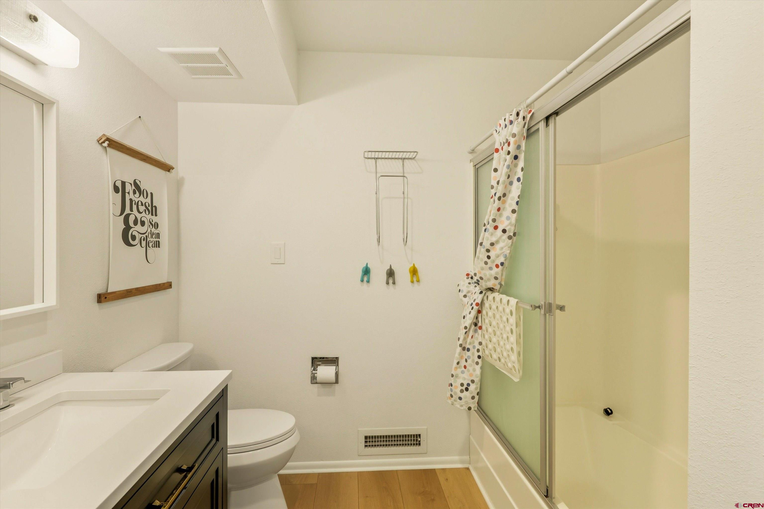 217 Pinon Causeway, Unit 3022 Pagosa Springs, CO 81147 - Photo 29 of 42 a bathroom with a sink a toilet and shower