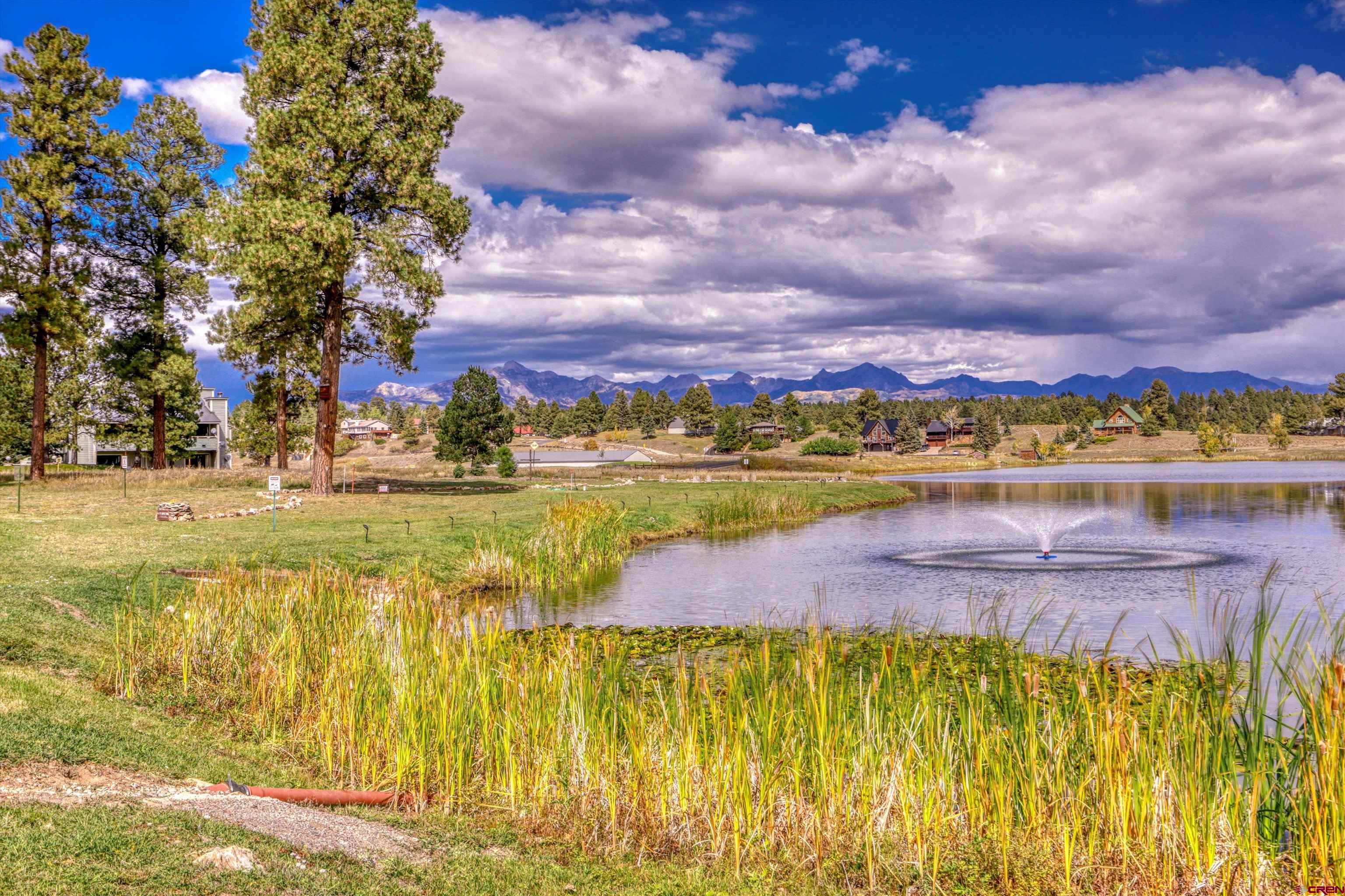 217 Pinon Causeway, Unit 3022 Pagosa Springs, CO 81147 - Photo 37 of 42 a view of an swimming pool with an outdoor seating