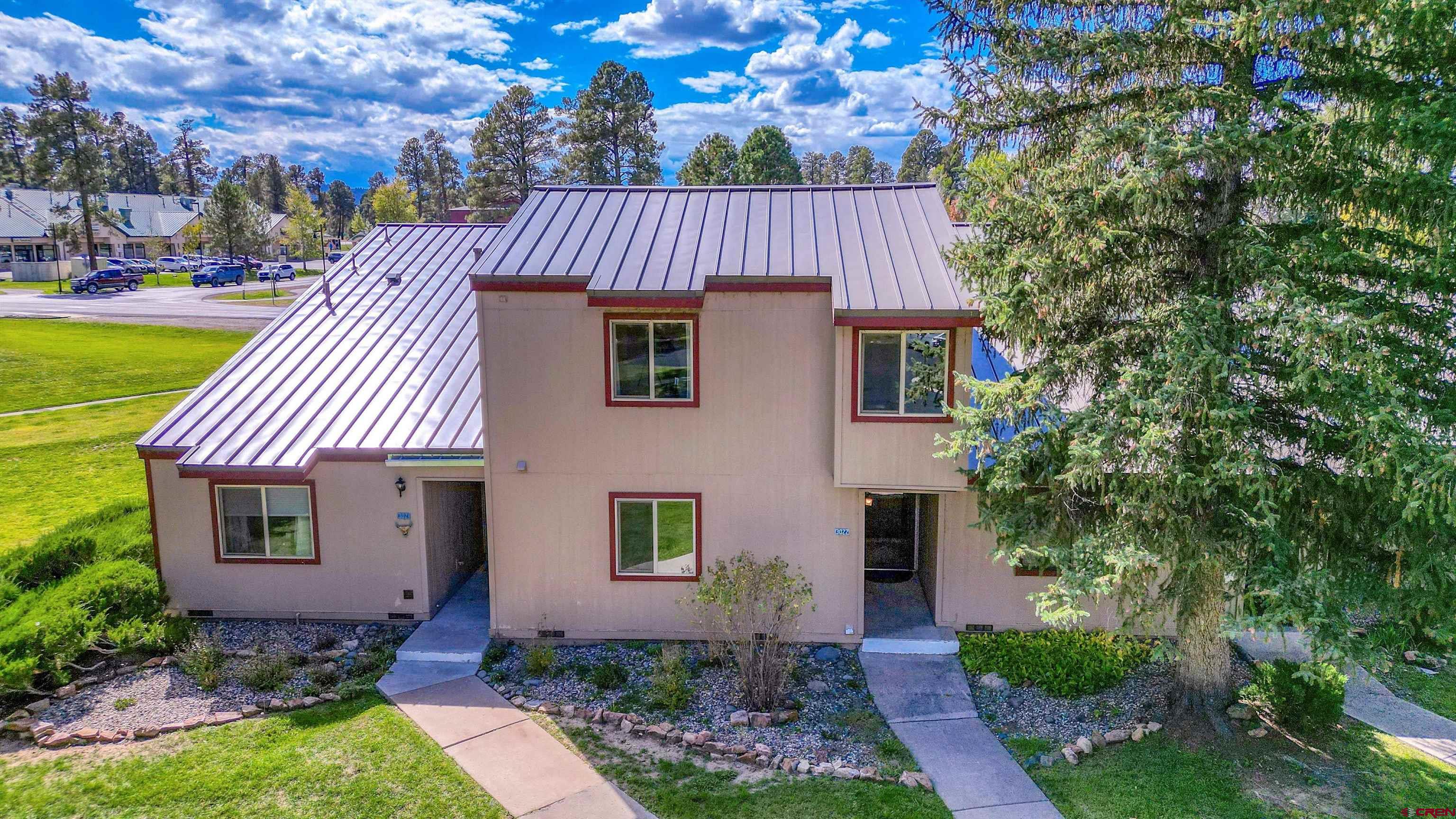 217 Pinon Causeway, Unit 3022 Pagosa Springs, CO 81147 - Photo 38 of 42 a view of a house with backyard and garden