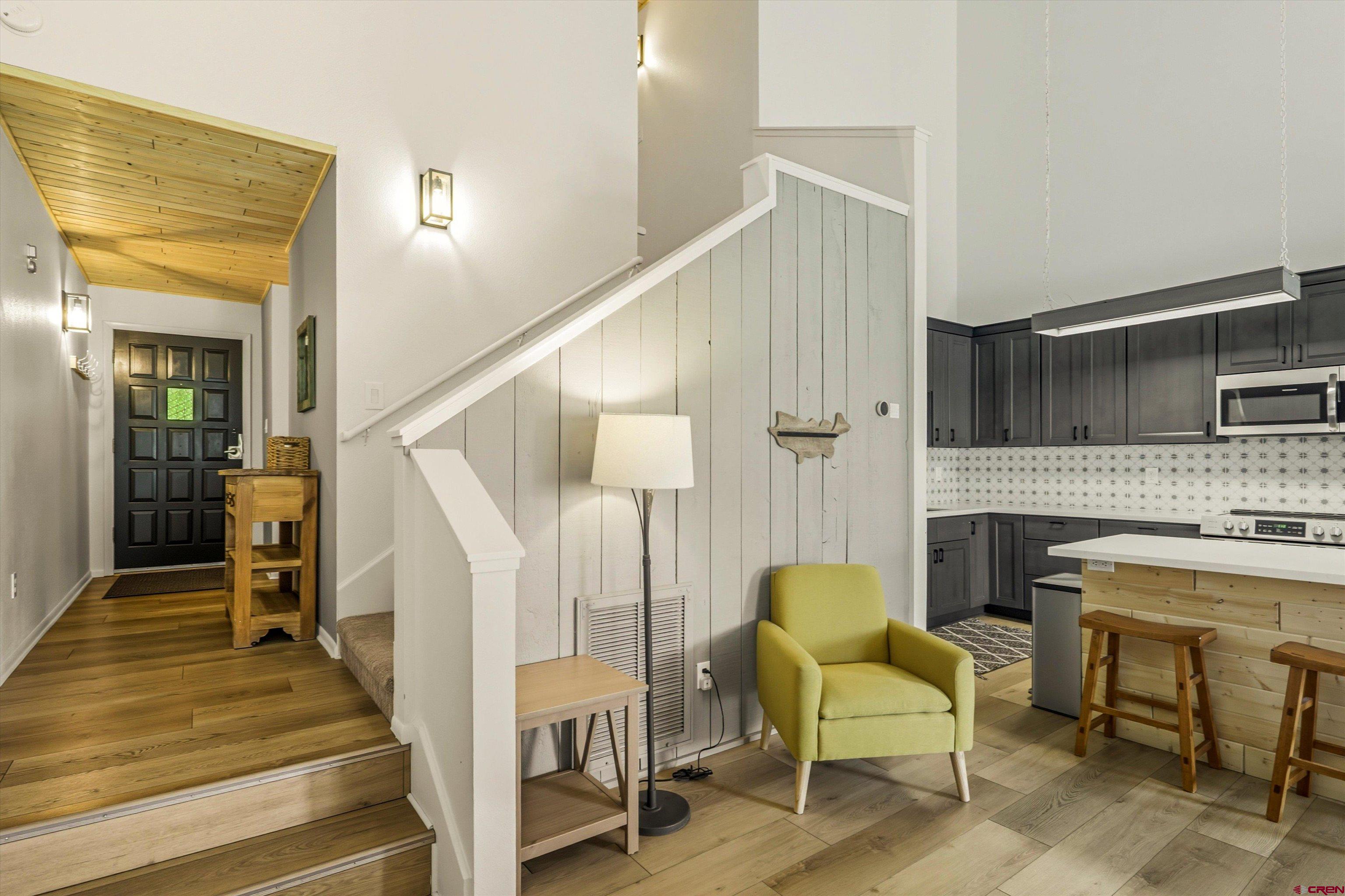 217 Pinon Causeway, Unit 3022 Pagosa Springs, CO 81147 - Photo 7 of 42 a living room with furniture and a fireplace