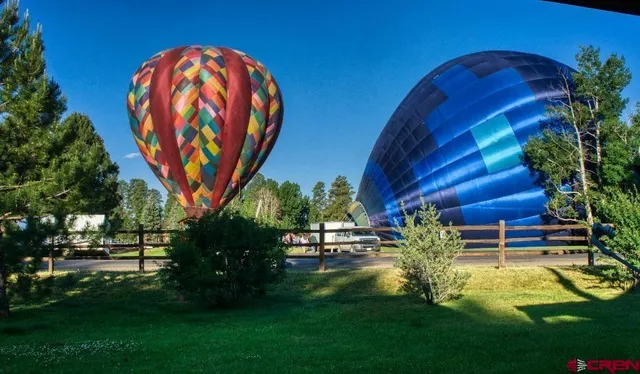 a view of a backyard with sitting area