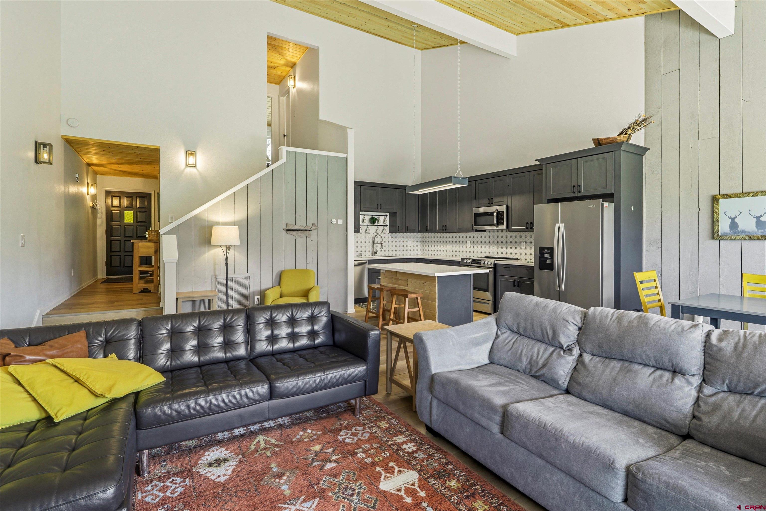 217 Pinon Causeway, Unit 3022 Pagosa Springs, CO 81147 - Photo 9 of 42 a living room with furniture and a chandelier