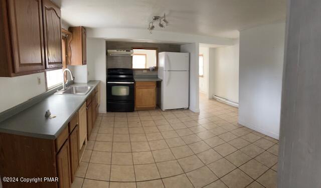 6663-6665 Highway 191 Cresco, PA 18326 - Photo 1 of 12 a kitchen with granite countertop a refrigerator and a stove top oven