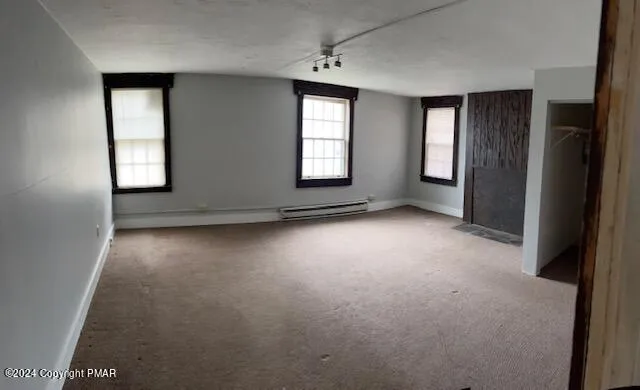 an empty room with windows