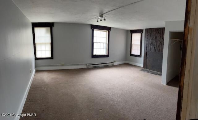 6663-6665 Highway 191 Cresco, PA 18326 - Photo 4 of 12 an empty room with windows