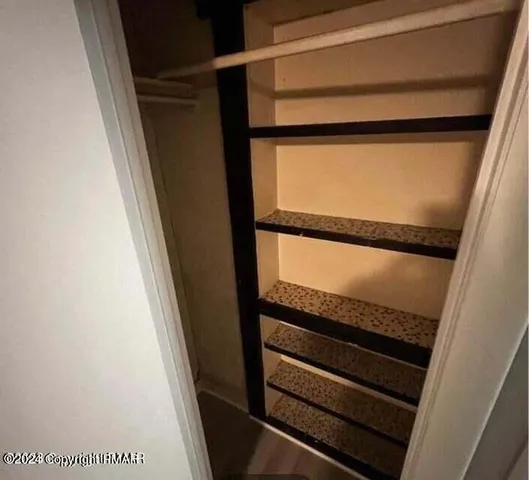 a bathroom with a toilet and a window