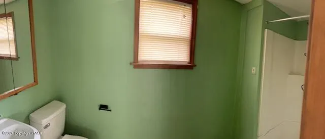 a kitchen with sink and cabinets