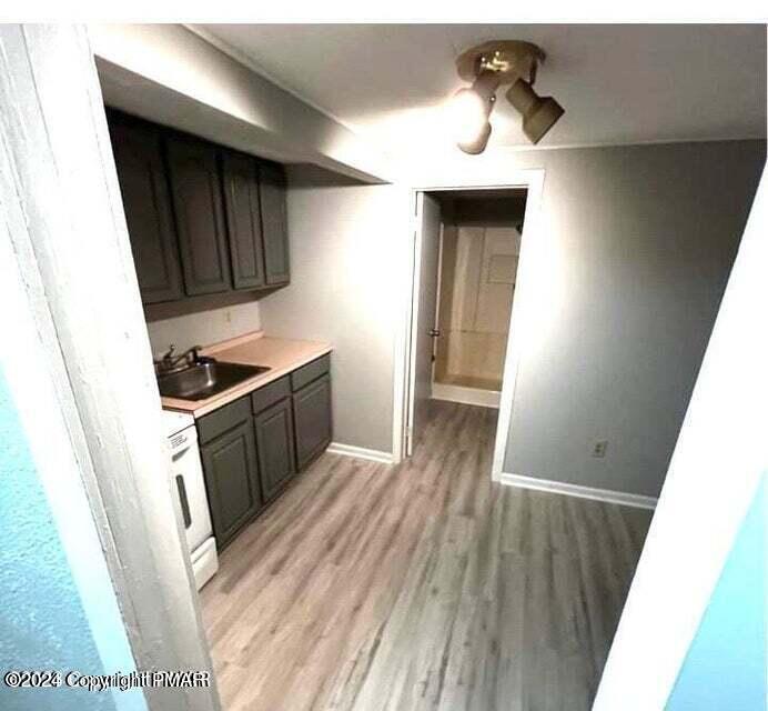 6663-6665 Highway 191 Cresco, PA 18326 - Photo 9 of 12 a kitchen with sink and cabinets