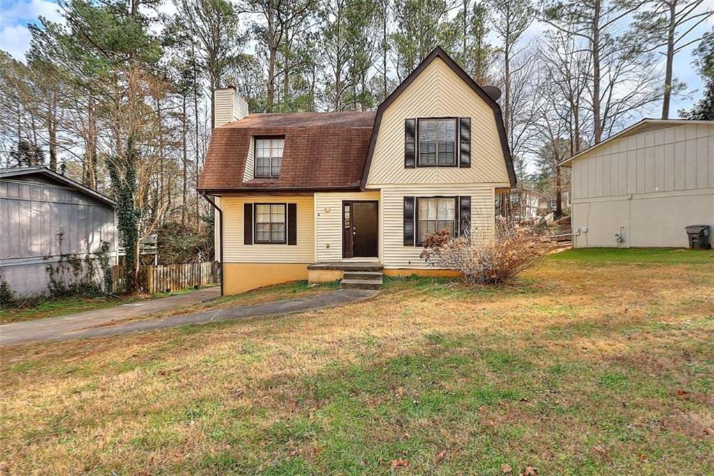 4048 Valley Brook Road Snellville, GA 30039 - Photo 1 of 1 a front view of a house with a yard