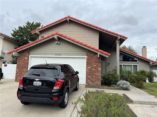 a view of a car in front of house