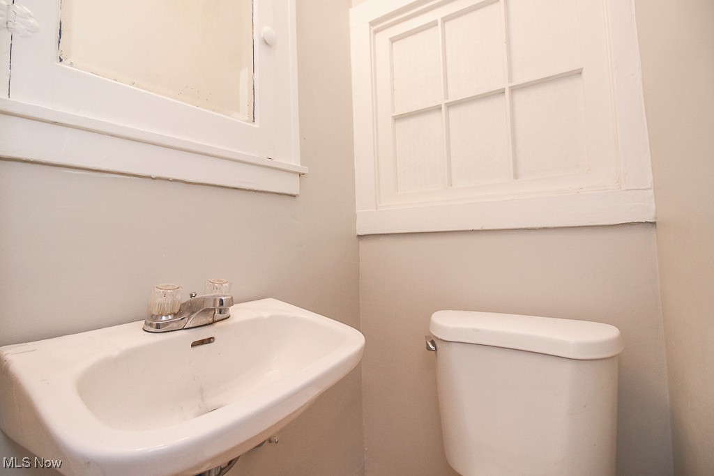3085 Somerton Road Cleveland, OH 44118 - Photo 10 of 16 Half bath with toilet and a sink