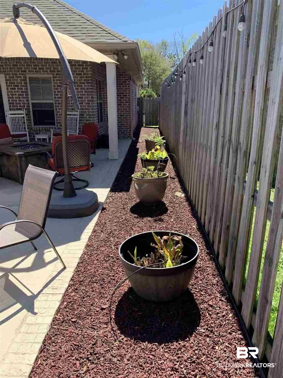 6154 Louise Place West Mobile, AL 36609 - Photo 23 of 25 Fully Fenced with Rubber Mulch