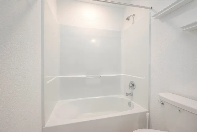 a bathroom with a sink a toilet and a bathtub